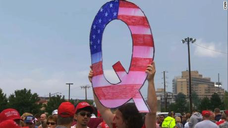  Head of NYPD union gives Fox News interview with QAnon mug in background