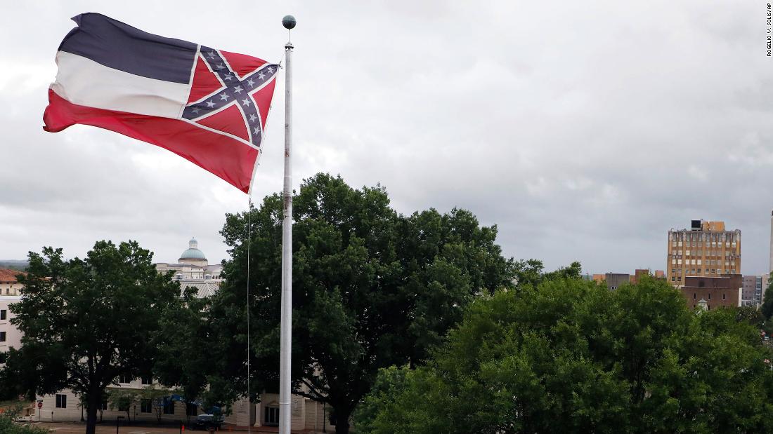  Mississippi governor signs bill to retire flag with Confederate emblem