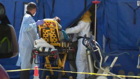  Coronavirus has infected almost every patient at this hospital. Medics are overwhelmed