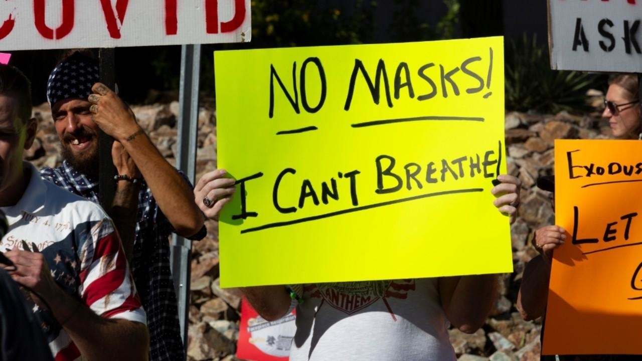 US leaders wrangle over mask use as new daily Covid-19 cases soar