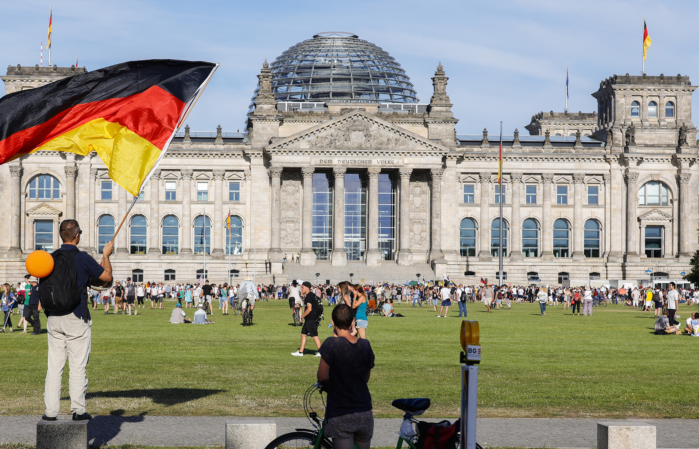 German leaders warn of coronavirus resurgence, condemn protest