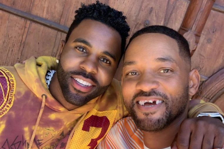  Actor Will Smith appears to have his front teeth knocked out by singer Jason Derulo in golf game gone wrong