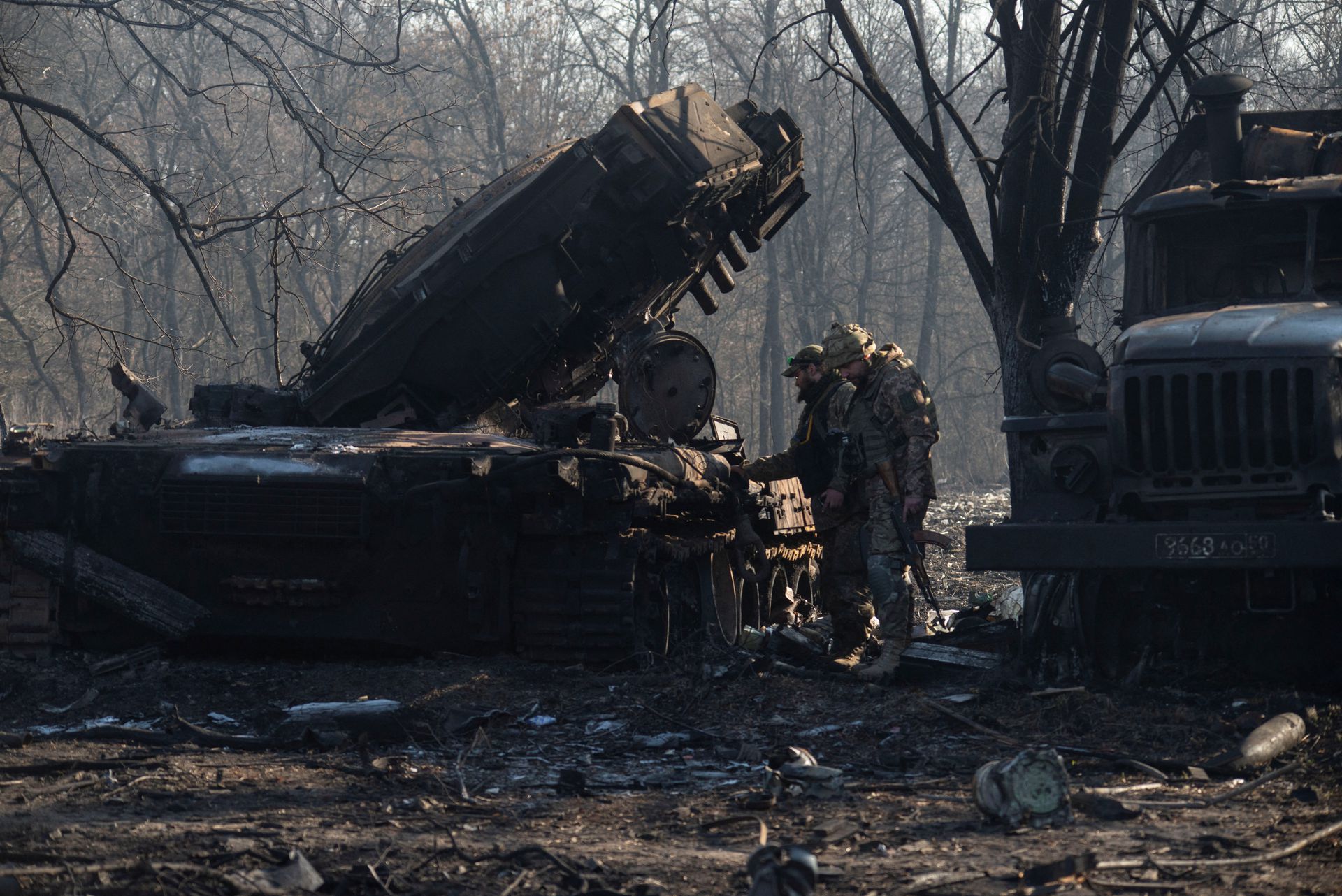 Ukrainian Forces inspecting destroyed Russian tank