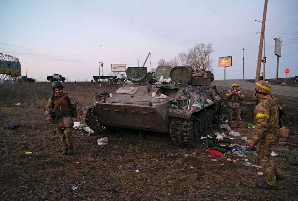Ukrainian servicemen in battle field as Ukraine unveils NFTs to support its armed forces