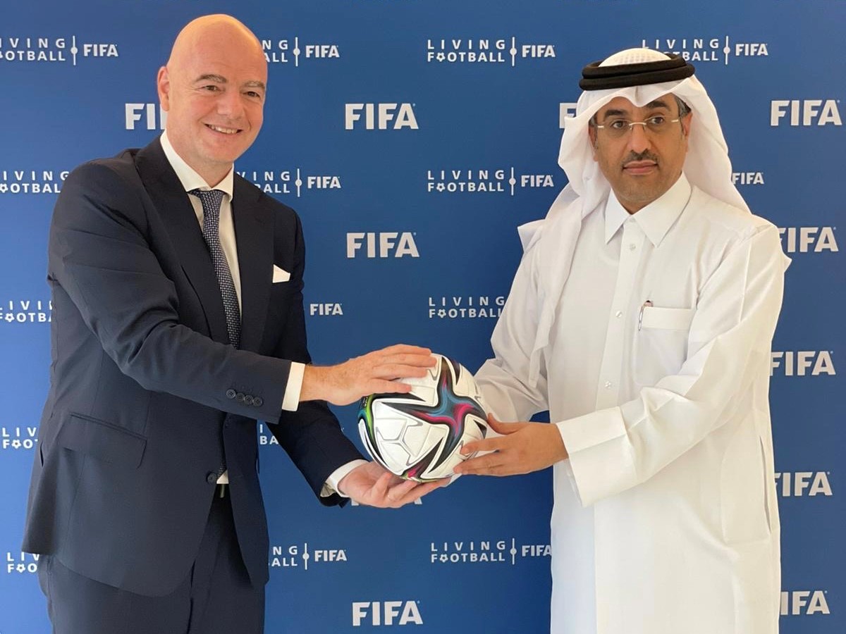 FIFA President with the Qatar Minister of Labour shaking hands