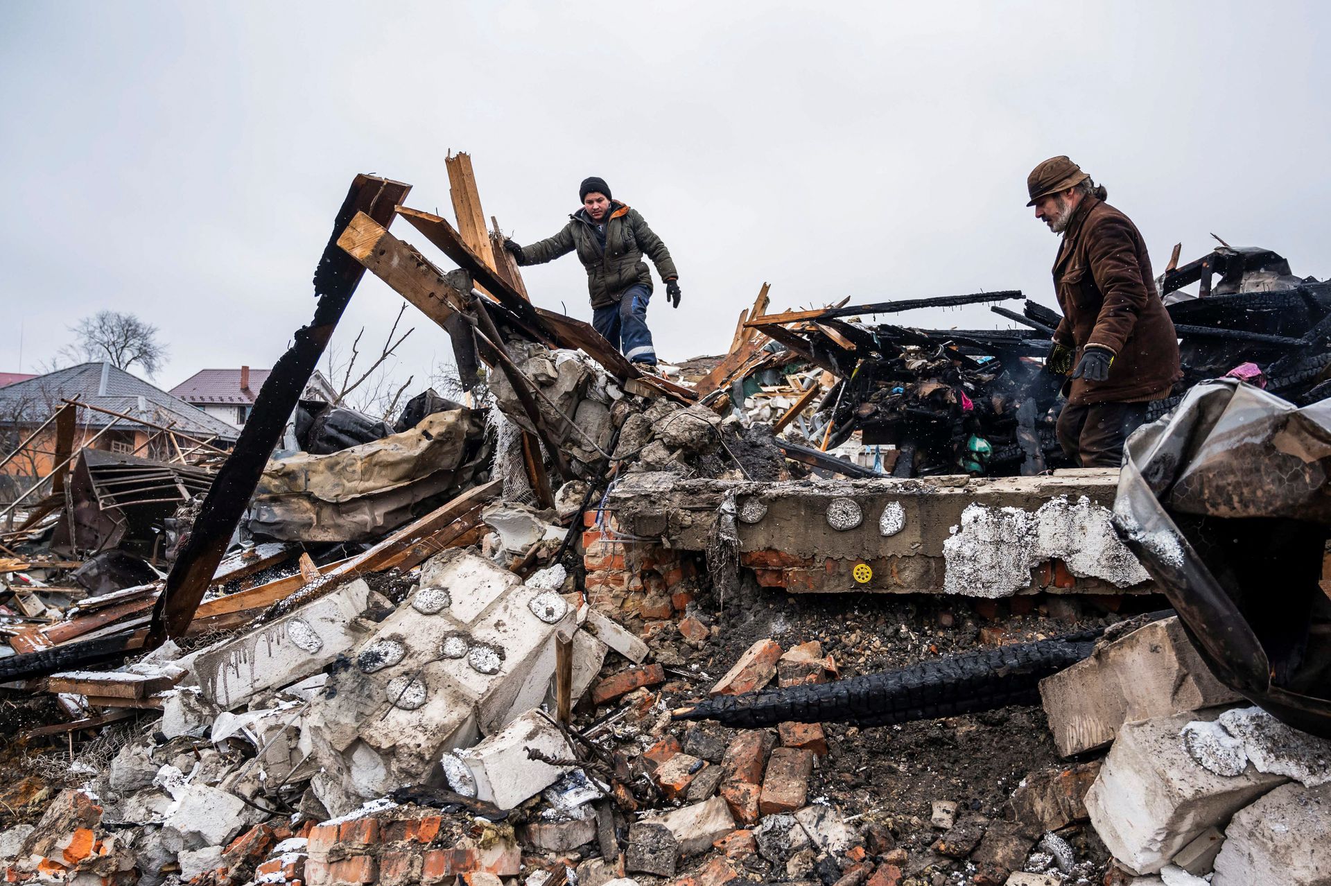 Residents remove debris as Russian invasion caused 1 million Ukrainian refugees to displace