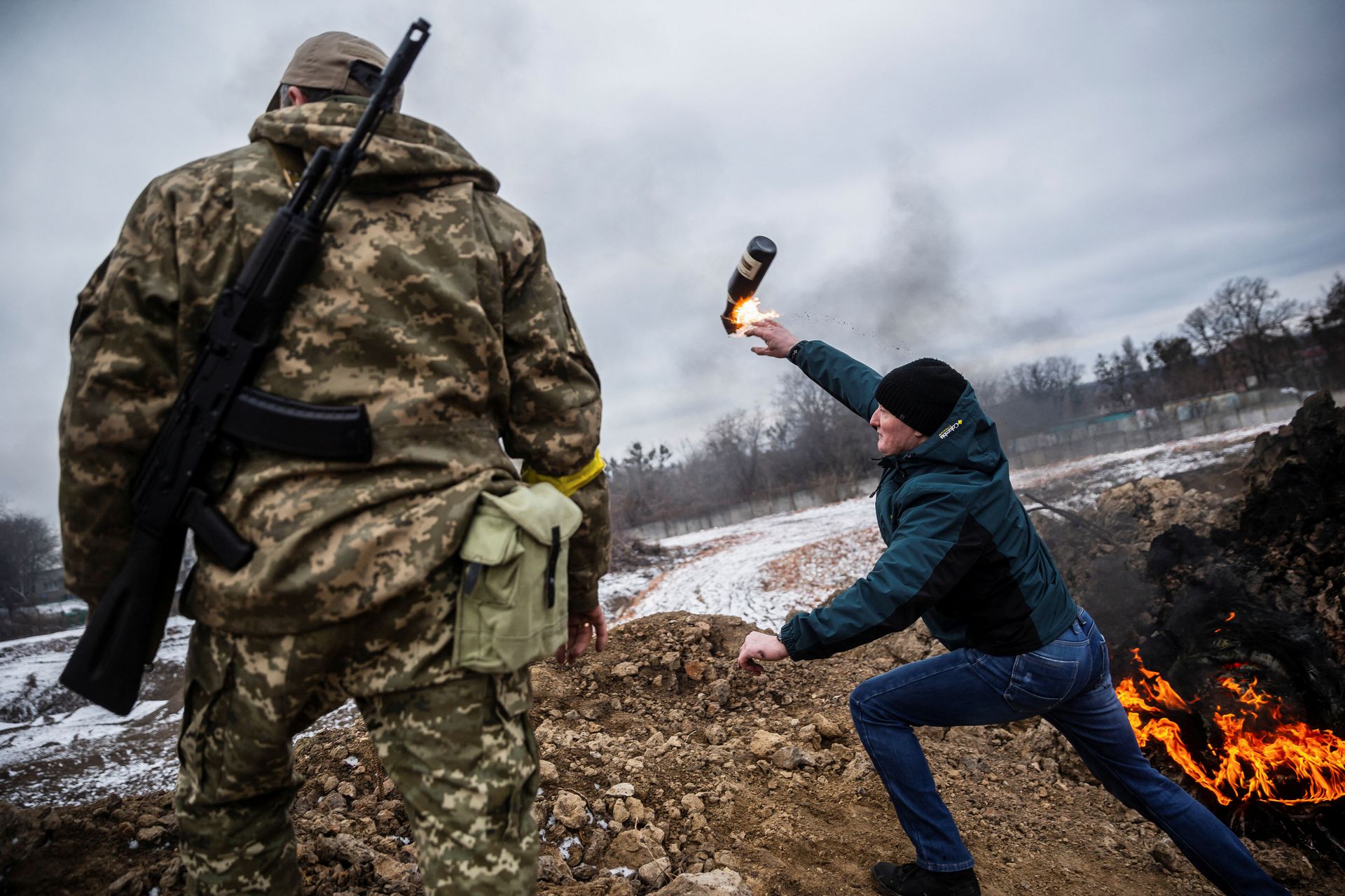 A man practicing throwing petrol bomb as Russian forces captured Kherson city