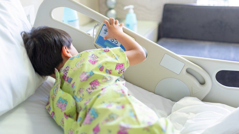 a child in hospital bed