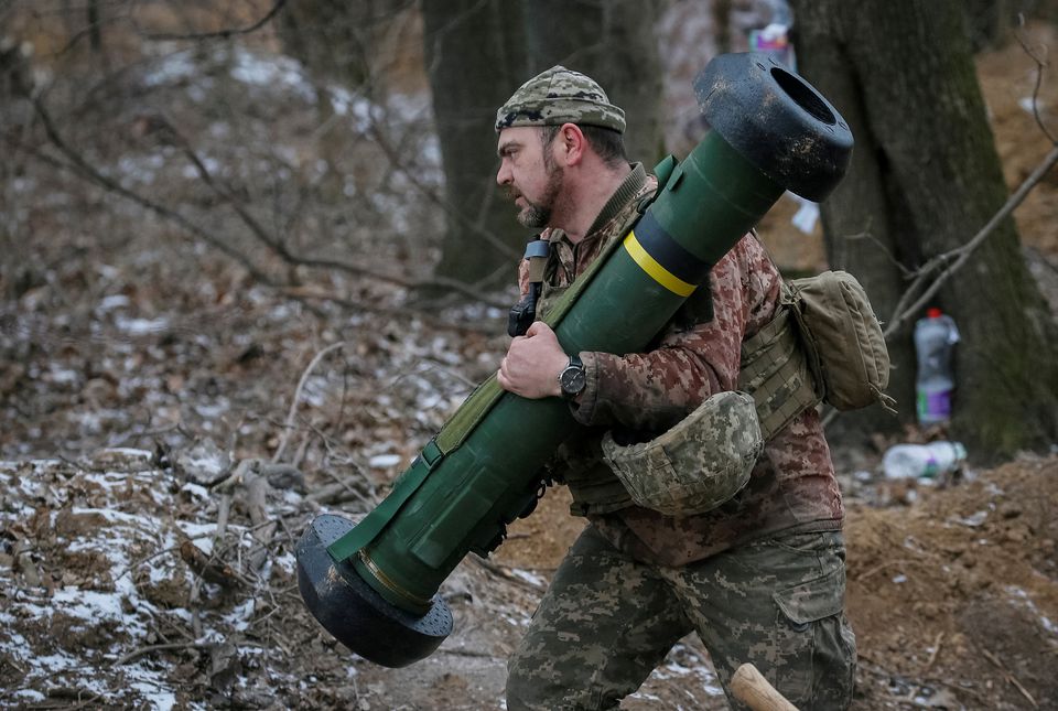 A Ukrainian service member holds a Javelin missile system