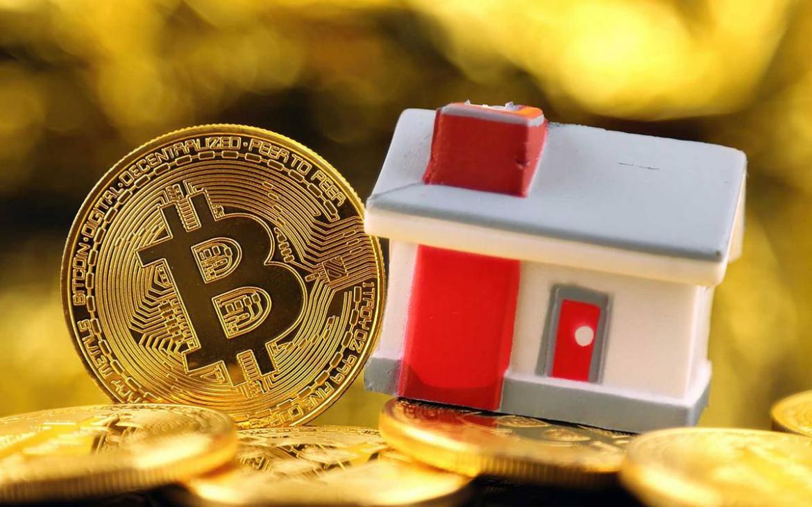 Coin and Bitcoin besides a tiny house