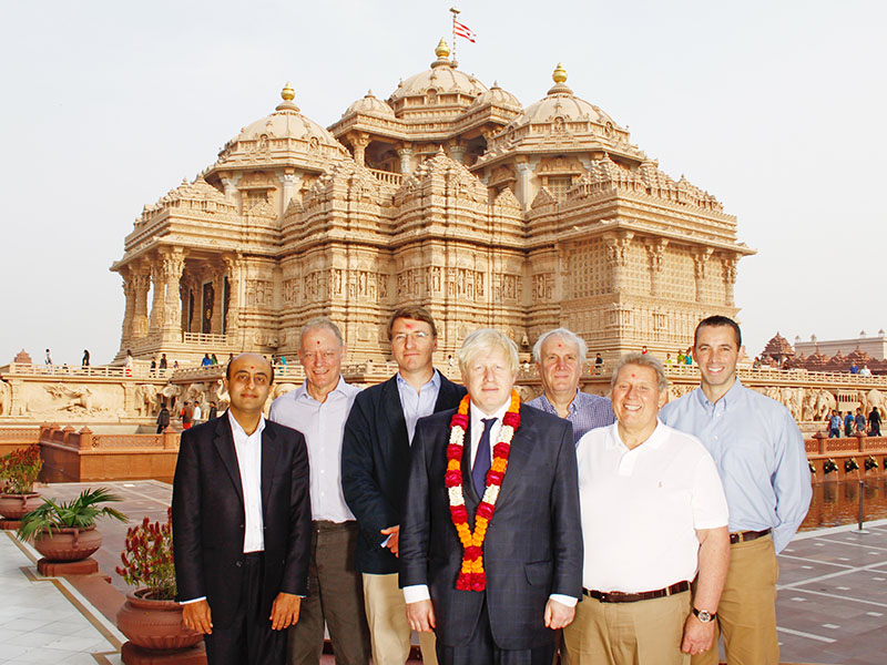 Boris Johnson poses with sadhus at the Swaminarayan Akshardham temple in Gandhinagar