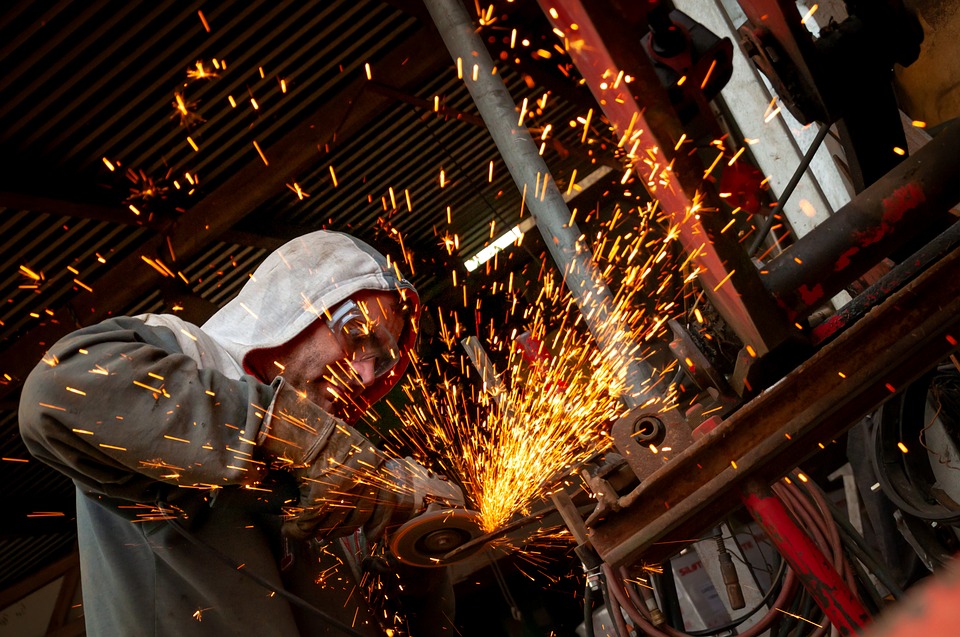 mechanic using angle grinder