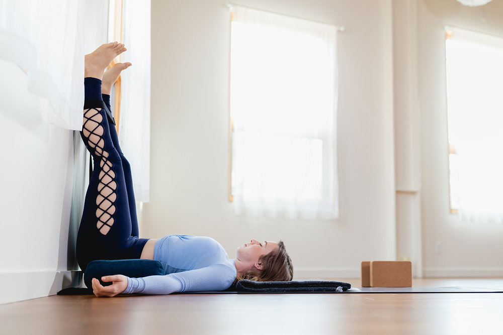 a girl doing exercise by Elevating Legs