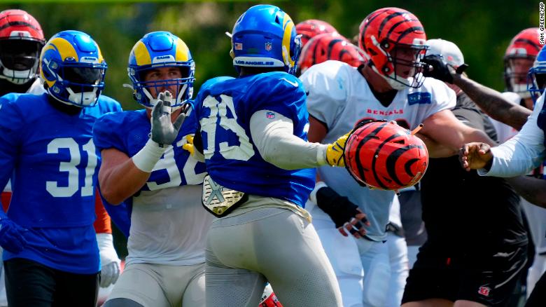  Rams star Aaron Donald appears to swing helmet at Bengals players in joint practice-ending brawl